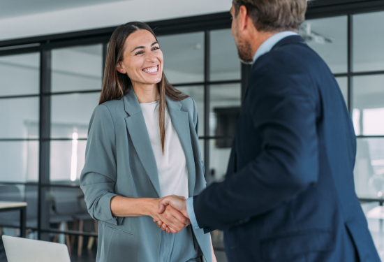 professional woman and man shaking hands